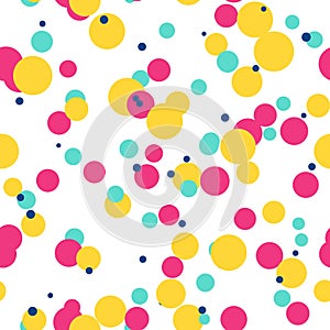 Messy colorful dots on white background. Magenta, blue, yellow festive seamless pattern with round shapes.