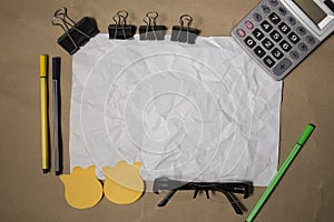 Messy Designer`s Table with Blank Note and Tools