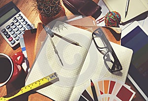 Messy Designer's Table with Tools Concept