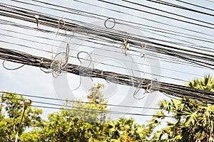 Messy electrical cables in thailand - Uncovered optical fiber technology open air outdoors asian cities