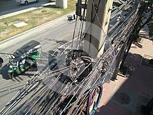 Messy electricity cables on pole