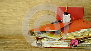 messy file folders, magnifying glass and question mark, red tape, bureaucracy, messy office, business concept