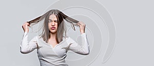 Messy hair. Frustrated woman having a bad hair. Woman having a bad hair, her hair is messy and tangled. Girl having a
