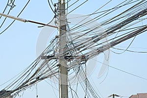 Messy of low voltage power cable on vivid sky background