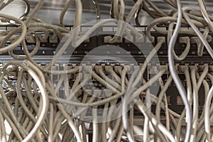 Messy network cabling at switch router cabinet.