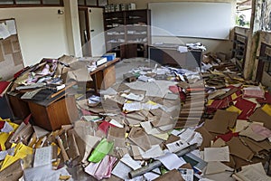 MESSY OFFICE FULL OF FOLDERS AND PAPERS