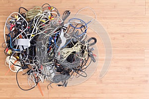 Messy tangle of old electric cords and connectors