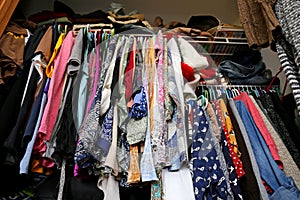 Messy Women's Closet Filled with Colorful Clothes