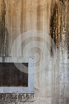 Metal air vent cover and dirty grunge wall