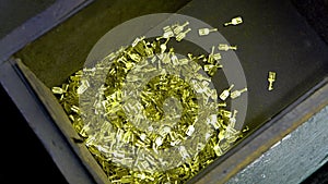 metal aluminum, copper wire tips fall into the basket of the manufacturing machine