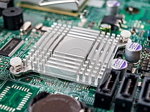 Metal aluminum radiator on the motherboard of a desktop computer, server, printed circuit board, electronic board