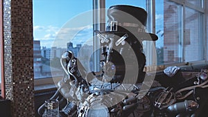 Metal android sitting at table in restaurant with glass of wine on background of view of high-rise buildings of city