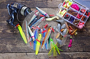 Metal angling bait and reel