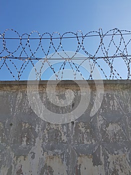 Metal barbed wire on the fence