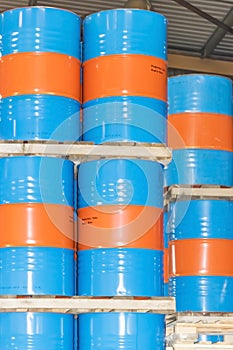 Metal barrels for storage and transportation of orange oil in the warehouse of canning orange factory or plant