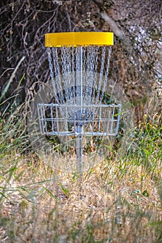 Metal basket for Frisbee Golf on a grassy course