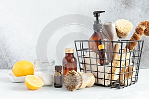 Metal basket with natural cleaning products and tools. Bamboo accessories and natural products for cleaning the kitchen
