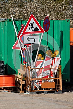 In  metal basket there are many different road signs