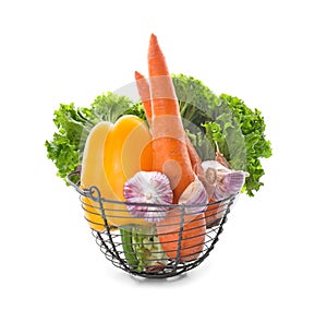 Metal basket with various fresh vegetables on white background