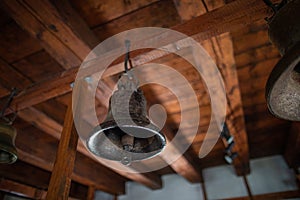 The metal bell inside the old bell tower