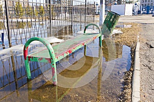 Metal bench and a metal rubbish bin