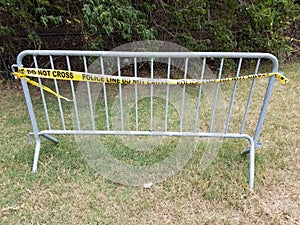 Metal bike rack with yellow police line do not cross tape