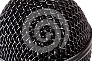 Metal black microphone grill macro, extreme closeup, reflective surface simple background texture, backdrop. Recording vocals photo