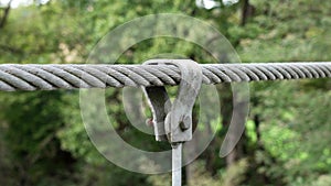 Metal bolted clip to a metal wire rope of a suspension bridge element