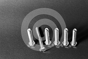 Metal bolts isolated on dark background