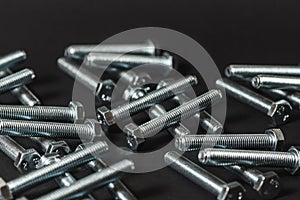 Metal bolts isolated on dark background