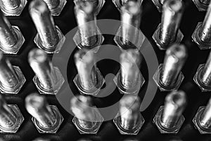 Metal bolts isolated on dark background