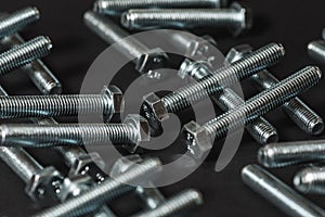 Metal bolts isolated on dark background