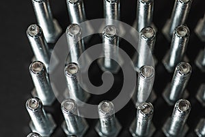 Metal bolts isolated on dark background