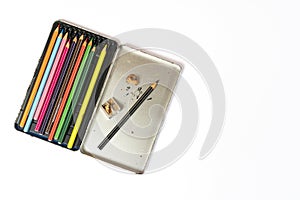 A metal box of colored pencils