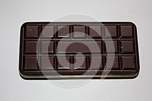 Metal box of dark brown colour for chocolate bar