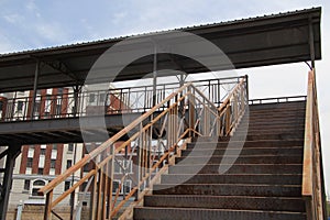 Metal bridge and stairs between buildings