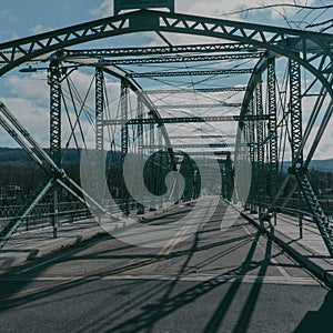 Metal bridge structure spanning across a wide roadway