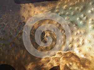 Metal bronze textured plate. Bronze or copper polished surface with dents, scratches and indentations. Metal texture