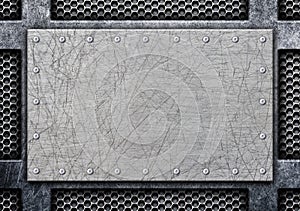 Metal brushed plate on iron perforated background