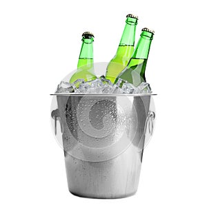 Metal bucket with bottles of beer and ice cubes isolated