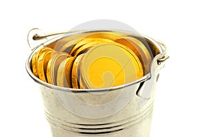 Metal bucket with gold coins