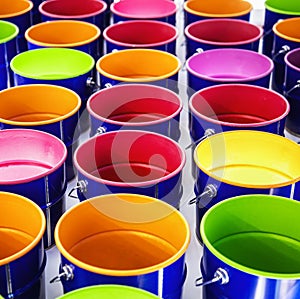 metal cans with multicolored paint. Background