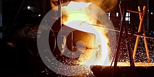 Metal cast process in blast furnace in metallurgical plant or factory.