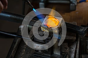 Metal Casting with blowtorch photo