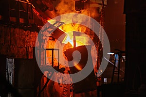 Metal casting process in metallurgical plant.Liquid metal pouring into ladle for casting