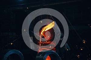 Metal casting process in metallurgical plant.Liquid metal pouring into molds