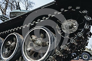 metal caterpillar track of old Soviet military tank in close-up