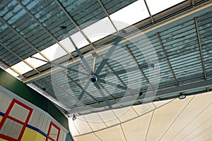 Metal ceiling and large fans for open air shopping mall buildin
