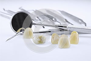 Metal ceramic dentures with dentist tools