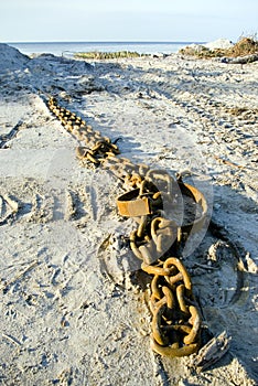 Metal chain lying on the beach